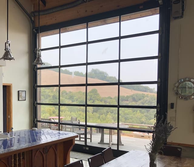 Overhead Glass Garage Doors: Safer, Space-Saving Alternative to Sliding Walls